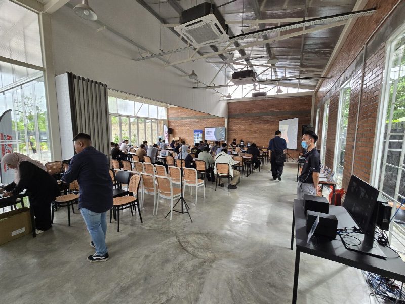 The room set up before doors opened — and the live demo stations, Synology NAS units out on the floor.