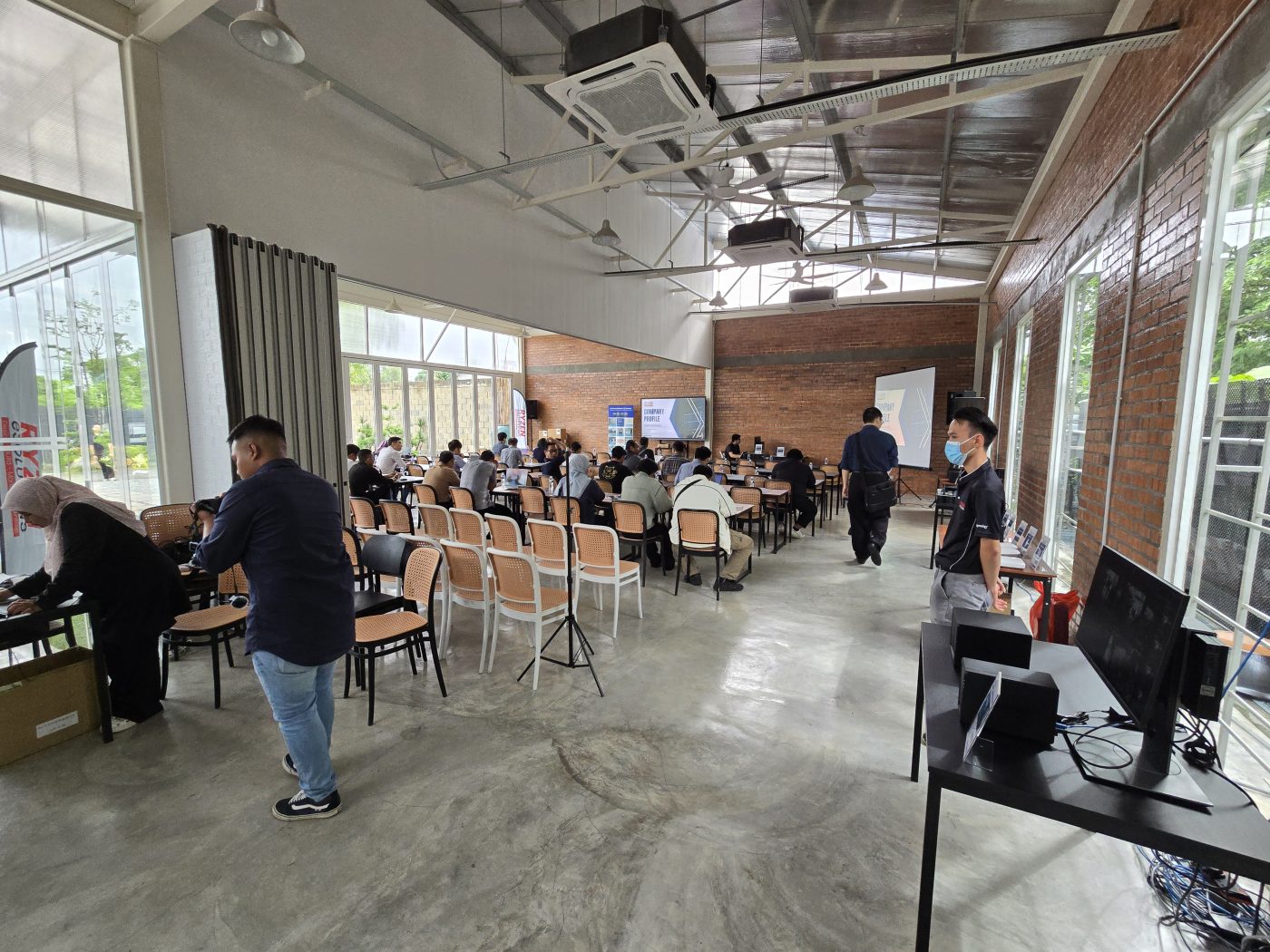 The room set up before doors opened — and the live demo stations, Synology NAS units out on the floor.