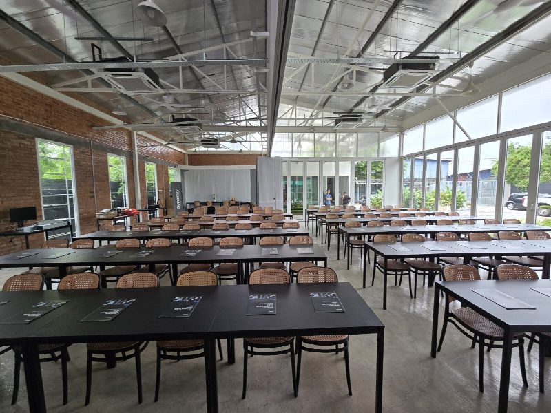 The room set up before doors opened — and the live demo stations, Synology NAS units out on the floor.